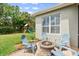 Backyard patio with a charming fire pit and comfortable seating, perfect for outdoor relaxation at 5907 90Th Avenue E Cir, Parrish, FL 34219