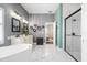 Elegant bathroom with a modern tub, walk-in shower, and double vanity at 5907 90Th Avenue E Cir, Parrish, FL 34219
