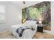 Inviting bedroom features a serene nature mural for a relaxing retreat at 5907 90Th Avenue E Cir, Parrish, FL 34219