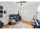 Home office with natural light, wood floors, multiple monitors, and musical instruments at 5907 90Th Avenue E Cir, Parrish, FL 34219