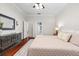 Spacious bedroom featuring wood floors and access to a closet and bathroom at 5907 90Th Avenue E Cir, Parrish, FL 34219