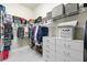 Organized walk-in closet with shelves, hanging rods, and storage drawers at 5907 90Th Avenue E Cir, Parrish, FL 34219