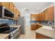 Beautiful kitchen with wood cabinets, granite countertops and stainless steel appliances at 5907 90Th Avenue E Cir, Parrish, FL 34219