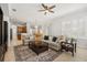 Comfortable living room with view to kitchen and dining area, tile floors, and neutral paint at 5907 90Th Avenue E Cir, Parrish, FL 34219