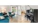 Inviting living room featuring comfortable seating, a piano, and views to the outside at 5907 90Th Avenue E Cir, Parrish, FL 34219