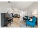 Open-concept living room with a piano, comfortable seating, and desk area at 5907 90Th Avenue E Cir, Parrish, FL 34219