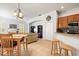 Open-concept living space featuring tile floors, an eat-in kitchen, and views of the living room at 5907 90Th Avenue E Cir, Parrish, FL 34219