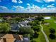 Overhead view of a property boasting solar panels, well-kept landscaping, and proximity to a golf course in a vibrant community at 600 Eagle Watch Ln, Osprey, FL 34229