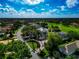 Inviting aerial view of a meticulously landscaped home featuring mature trees and lush greenery in a desirable golf community at 600 Eagle Watch Ln, Osprey, FL 34229