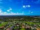 Panoramic aerial view of the golf course community, lake, and the beautiful surroundings at 600 Eagle Watch Ln, Osprey, FL 34229