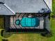 Overhead view of the pool in a screened enclosure, surrounded by lush landscaping at 600 Eagle Watch Ln, Osprey, FL 34229