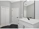 Modern bathroom features a vanity with black hardware and a large mirror at 600 Eagle Watch Ln, Osprey, FL 34229