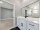 Elegant bathroom offers a stylish mirror, vanity, and a view of the shower at 600 Eagle Watch Ln, Osprey, FL 34229