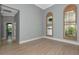 Sunlit bedroom with hardwood floors, wood shuttered windows and crown molding at 600 Eagle Watch Ln, Osprey, FL 34229