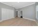 Large bedroom has hardwood floors, a window with view, and dual closets for storage at 600 Eagle Watch Ln, Osprey, FL 34229