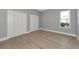 Bedroom features a window with outdoor views and two white closets for plenty of storage at 600 Eagle Watch Ln, Osprey, FL 34229