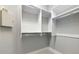Walk-in closet featuring built-in shelving and ample storage space at 600 Eagle Watch Ln, Osprey, FL 34229