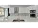 Close up view of the kitchen with stainless steel appliances and mosaic backsplash at 600 Eagle Watch Ln, Osprey, FL 34229