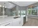 Kitchen with center island, stainless steel appliances, modern lighting, and bar at 600 Eagle Watch Ln, Osprey, FL 34229