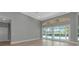 Open living area with high ceilings, large sliding doors to the patio and pool views at 600 Eagle Watch Ln, Osprey, FL 34229