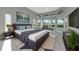 Spacious main bedroom with tray ceilings, ample natural light, and a calming color palette at 600 Eagle Watch Ln, Osprey, FL 34229
