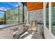 Modern outdoor kitchen with stainless steel grill, stone countertop, and plenty of storage for outdoor cooking at 600 Eagle Watch Ln, Osprey, FL 34229