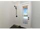 Walk-in shower with black fixtures and outdoor access to the pool at 600 Eagle Watch Ln, Osprey, FL 34229