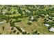 Stunning aerial view of property's boundaries, showcasing its expansive acreage, pond and buildings at 6540 Prairie Junction Trl, Sarasota, FL 34241