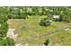 Expansive property with lush green pastures, mature trees, and wooden fencing at 6540 Prairie Junction Trl, Sarasota, FL 34241