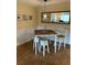 Intimate dining area with seating for four, complete with stylish decor and wood floors at 6703 Midnight Pass Rd # 206, Sarasota, FL 34242