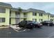 Inviting condo building featuring a well-maintained exterior and convenient parking at 6703 Midnight Pass Rd # 206, Sarasota, FL 34242