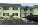 Inviting condo building featuring a well-maintained exterior and convenient parking at 6703 Midnight Pass Rd # 206, Sarasota, FL 34242