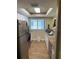 Bright kitchen with stainless steel appliances, granite countertops, and modern lighting at 6703 Midnight Pass Rd # 206, Sarasota, FL 34242