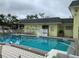 Community pool and surrounding area at 6703 Midnight Pass Rd # 206, Sarasota, FL 34242