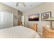 Comfortable bedroom featuring a ceiling fan, TV, carpet, and a closet for storage at 736 Rosemary Cir, Bradenton, FL 34212