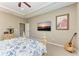 Comfortable bedroom featuring carpet flooring, a ceiling fan, and a flatscreen TV at 736 Rosemary Cir, Bradenton, FL 34212