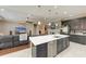 Open layout features modern kitchen island, flowing into a comfortable living space perfect for entertaining or relaxing at 736 Rosemary Cir, Bradenton, FL 34212