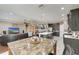 Open concept kitchen flows into the living room with a large island and plenty of counter space at 736 Rosemary Cir, Bradenton, FL 34212