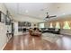 Spacious open-concept living area with modern lighting, hardwood floors, and comfortable seating at 736 Rosemary Cir, Bradenton, FL 34212