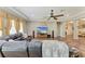 Gathering room showcases a large TV, hardwood flooring, comfortable seating, and neutral decor at 736 Rosemary Cir, Bradenton, FL 34212