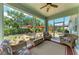 Inviting screened-in porch with stylish seating, perfect for enjoying the outdoor garden view at 736 Rosemary Cir, Bradenton, FL 34212
