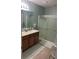 Bathroom features double sinks, granite countertops, and glass enclosed shower at 7508 Mikasa Dr, Punta Gorda, FL 33950