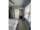 Bedroom view showcasing the closet, window with blinds, and tiled floors for a clean look at 7508 Mikasa Dr, Punta Gorda, FL 33950