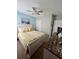 Comfortable bedroom featuring a bed with floral patterned bedding and a rustic dresser at 7508 Mikasa Dr, Punta Gorda, FL 33950