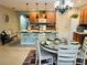 Spacious kitchen with a center island, ample counter space, modern appliances, and a casual dining area at 7508 Mikasa Dr, Punta Gorda, FL 33950