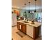 Bright kitchen with granite countertops, stainless steel appliances, and a view of the dining area and outdoor patio at 7508 Mikasa Dr, Punta Gorda, FL 33950
