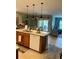 Open kitchen with a granite island flowing into the living area, creating a seamless space at 7508 Mikasa Dr, Punta Gorda, FL 33950