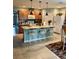 Charming kitchen with breakfast bar, granite countertops, and warm, inviting cabinetry at 7508 Mikasa Dr, Punta Gorda, FL 33950