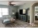 Inviting living room with comfortable seating, a ceiling fan, and a view of the television for relaxing evenings at 7508 Mikasa Dr, Punta Gorda, FL 33950