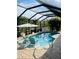 Enjoy the refreshing pool with a screened enclosure and lovely outdoor furniture at 7508 Mikasa Dr, Punta Gorda, FL 33950